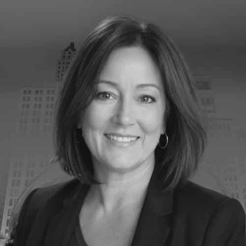 Kristina Harley, smiling, in a dark blazer